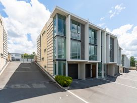 Exterior view of a contemporary building with garage and driveway at Lake Taupo Holiday Home Taupo