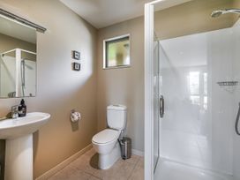 A bathroom with sink, toilet, and shower at Vintners - Renwick Holiday Home, Blenheim