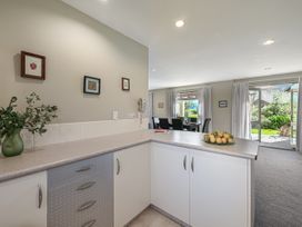 A kitchen with a counter and fruit on a plate at Vintners - Renwick Holiday Home in Blenheim