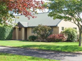 A house with trees and grass at Vintners - Renwick Holiday Home in Blenheim