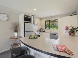 A kitchen with appliances and a fruit bowl at Vintners - Renwick Holiday Home, Blenheim