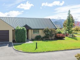 A house with a garage and garden at Vintners - Renwick Holiday Home in Blenheim