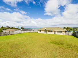 An outdoor view of a house and garden at Bay Heights Bach - Bay Of Islands Retreat, Kaitaia