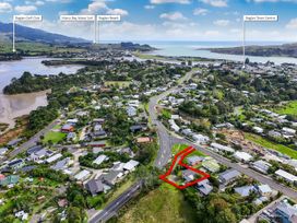 An aerial view of Raglan showing town features near the coast at Raglan Holiday Home in Raglan