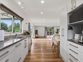A kitchen with a sink and countertop at Sundowners - Mangawhai Heads Holiday Home Mangawhai