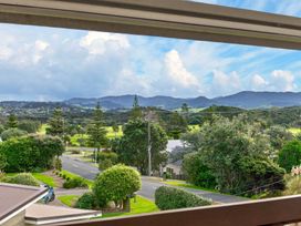 A view of mountains and trees from a property at Sundowners - Mangawhai Heads Holiday Home in Mangawhai
