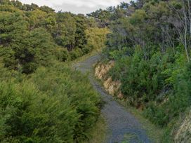 A gravel path surrounded by vegetation at Little Tui Ridge - Coromandel Holiday Home, Coromandel