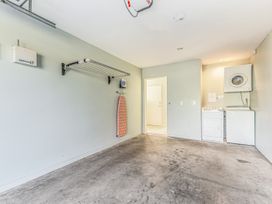 A laundry room with washer and dryer at Vineyard View - Blenheim Holiday Home