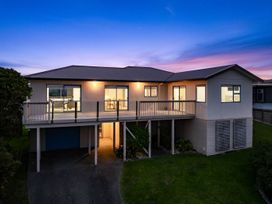 A house with balcony and garage at La Maison Bleu - Mangawhai Heads Holiday Home Mangawhai