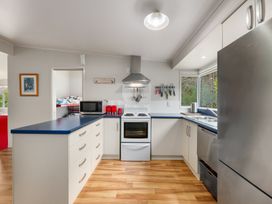 A kitchen with appliances and counter space at Picton Holiday Home in Picton