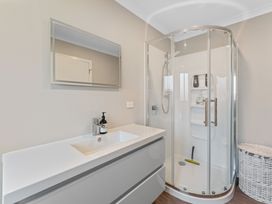 A bathroom featuring a shower and sink at Turangi Holiday Home in Turangi
