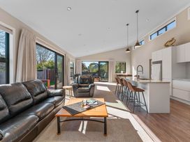 A living room with a sofa and coffee table at Turangi Holiday Home in Turangi