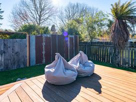 Two bean bags on a deck in the garden at Turangi Holiday Home in Turangi