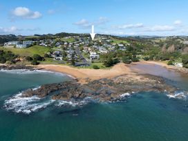 An aerial view of a beach and houses at Bay View Escape - Cable Bay Holiday Home Cable Bay