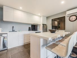 A kitchen with a countertop and appliances at The Sounds Hideaway - Moetapu Bay