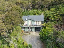 A house surrounded by trees at The Sounds Hideaway - Moetapu Bay
