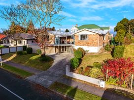 A house with a driveway and garden at Lola's - Cambridge Holiday Home in Morrinsville