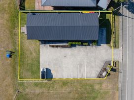 An outdoor view of a building and parking lot at Dusky Rugby Unit - Te Anau Holiday Home Te Anau
