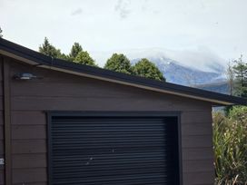 A garage in front of mountains at Snow Retreat - Waimarino Holiday Home National Park