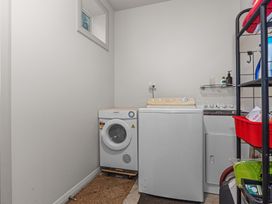 A laundry room with a washing machine and dryer at Langs Beach Holiday Home in Langs Beach