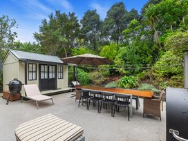 An outdoor space with a table and chairs at Langs Beach Holiday Home in Langs Beach