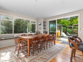 A dining room with a table and chairs at Langs Beach Holiday Home, Langs Beach
