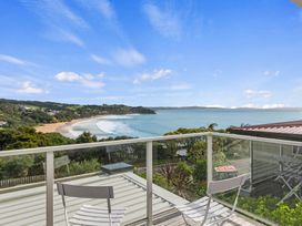 A view of the ocean and beach from an outdoor balcony at Langs Beach Holiday Home in Langs Beach