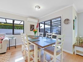A dining area with a table and chairs at Roy-Al Retreat - Riwaka Holiday Home Riwaka