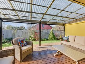 An outdoor area with a sofa and coffee table at Roy-Al Retreat - Riwaka Holiday Home Riwaka