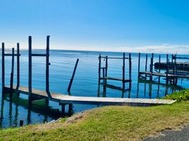 A dock extending into the water at Roy-Al Retreat - Riwaka Holiday Home Riwaka