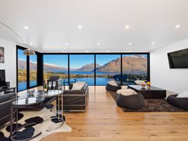A living room with a lake view at Alpine Haven - Queenstown Villa Queenstown