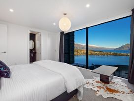 A bedroom with a window view at Alpine Haven - Queenstown Villa in Queenstown