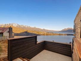 An outdoor area with a view of mountains and water at Alpine Haven - Queenstown Villa, Queenstown