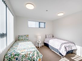 A bedroom with two beds and a lamp at Mayfair Haven - Hastings Holiday Home in Hastings