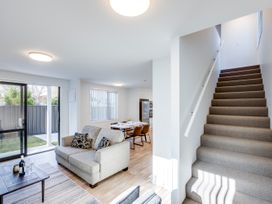 A living room with a sofa and coffee table at Mayfair Haven - Hastings Holiday Home in Hastings