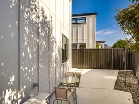An outdoor seating area with a table and chairs at Mayfair Haven - Hastings Holiday Home in Hastings