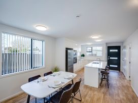 A kitchen with a dining table and chairs at Mayfair Haven - Hastings Holiday Home