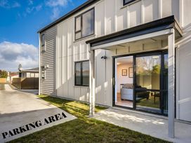 An outdoor parking area with view of a house at Mayfair Haven - Hastings Holiday Home, Hastings