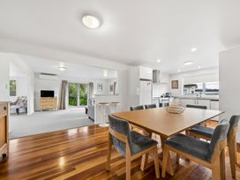 A dining room with a table and chairs at Martinborough Holiday Home in Martinborough