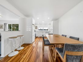A dining room with a table and chairs at Martinborough Holiday Home in Martinborough