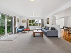 A living room with a sofa and coffee table at Martinborough Holiday Home in Martinborough