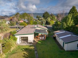 An aerial view of a house with a garden and solar panels at The Green House in 