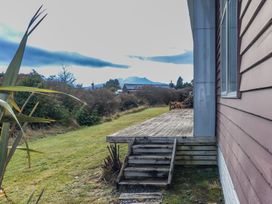 An outdoor view of a deck and garden at Ohakune Holiday Home in Ohakune