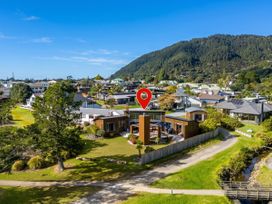 A property with trees and a pathway at Ocean Breeze Family Haven - Pauanui
