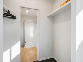 A bathroom with a shower and toilet at Panorama View Retreat - Bachcare Holiday Home, Pauanui