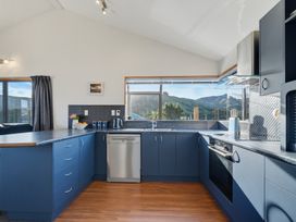 A kitchen with appliances and a view at Belle Vue in Akaroa
