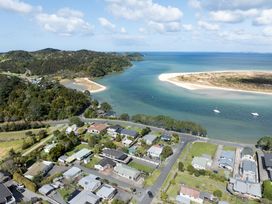 An aerial view of houses near water at Calden Cottage - Ngurunguru Holiday Home Ngunguru