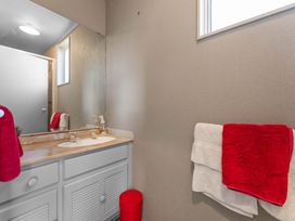 A bathroom with a sink and towels at JOE'S Getaway - Omori Holiday Home, Omori