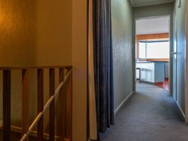 A hallway with a curtain and doorway at JOE'S Getaway - Omori Holiday Home, Omori