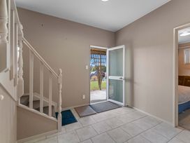 An entryway with a staircase and a front door at JOE'S Getaway - Omori Holiday Home, Omori